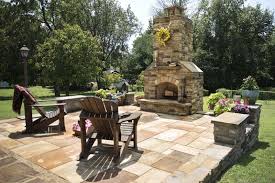 Outdoor dinning table with beer or wine cooler for summer party. Diy Stonework Donora Man Builds Patio And Outdoor Fireplace At Home