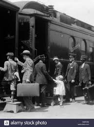 Stock Photo 1920s Family Mother Father Son Daughter Boarding Passenger Train Assisted By Trainman And Porters Carrying Luggage Train Passenger Train Engineer
