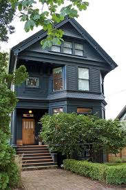 Black door with warm, bold exterior. Victorian Houses Victorian House Colors Modern Victorian Homes House Exterior