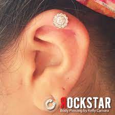 Odyssey Titanium Multi Faceted Gem Threaded Flower In A Helix Piercing From Rockstar In Providence Ri Body Jewelry Beautiful Jewelry Jewelry