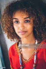 Portrait Of Beautiful Young Ethiopian Woman In Traditional Clothing Beautiful Ethiopian Women Curly Hair Women Ethiopian Women