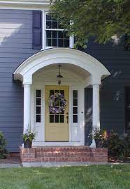 As i've been saying the overall porch this home has a covered front porch design but because it's modern with a flat roof there's no need for posts. Front Entry Design Front Door Remodeling Owings Brothers Porch Design Portico Design Front Porch Design
