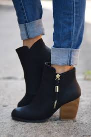 Black Booties With Brown Heel Pin On All Of The Clothes