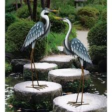 Putting plants inside pots and saucers also makes watering and care easier as the saucer catches excess water. Regal Large Blue Heron Metal Garden Statuary Looking Down 11781 The Home Depot Garden Statues Metal Garden Art Garden