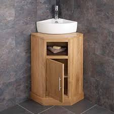 If you love it simple, plain with a little bit of accent, you can try having the cabinet in general wood color, granite countertop, and catchy backsplash pattern. Freestanding Oak Corner Bathroom Cabinet White Basin Set