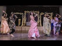 Indian Wedding Reception Dance Couple S Love Story Skit Bollywood Dance Sangeet Pakistani Wedding Dance Indian Wedding Bridesmaids Indian Wedding Songs