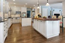 20 Kitchen Island Designs That Will Inspire You Curated Photo Collection Wood Tile Kitchen White Kitchen Wood Floors Wood Floor Kitchen
