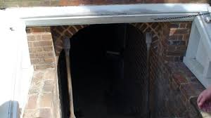 Man cups hand around mouth and shouts. Cost To Install A Bulkhead Door For Your Basement Housesumo Com