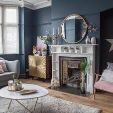 Living Room Makeover With Dark Blue Walls Pink Sofa And Gold Accessories Blue Living Room Decor Blue Walls Living Room Gold Living Room