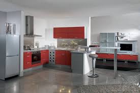 The ornate red cabinets paired with black hardware blend well with the yellow wall paint and the white subway tile backsplash. Kitchen Idea Of The Day Modern Red Kitchens By Alno Ag Red Kitchen Cabinets Modern Kitchen Modern White Kitchen Island