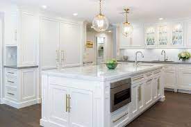 6 base cabinets 10 upper, wall oven, desk, and vanity! White Kitchen Island With Long Brass Pulls Transitional Kitchen