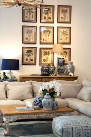 Check spelling or type a new query. British Colonial Style Wall Gallery Palm Prints Add Blue And White Chinoiserie As Acce Tropical Home Decor British Colonial Decor Chandelier In Living Room