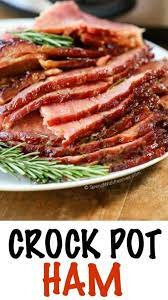 A Plate Of Slices Of Ham With Rosemary For Garnish Crockpot Ham Ham Recipes Crockpot Holiday Ham Recipes