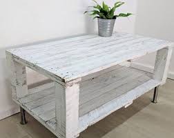 Large top, thicker low legs and a white distressed look all are to hold the attention! Distressed Aged White Pallet Coffee Table Ahvima Made Of Reclaimed Timber Shabby Chic Old Look Boho Wood Furniture Rust Coffee Table Table Coffee Table Grey