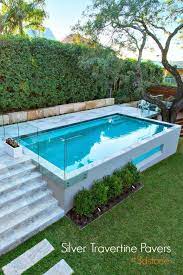 Real clay brick deck/patio and all natural blue stone as the pool coping. Gorgeous Elevated Pool Backyard Pool Landscaping Small Pool Design