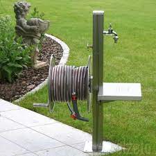 Have a large garden and wish for a tap and water hose feed away from your house ? Stainless Steel Garden Tap Station With Hose Reel Tap And Platform Homify Modern Garden Diy Garden Projects Modern Garden Design