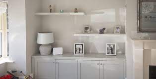 Centre modern furniture around a cubic rug. Enigma Design Tv And Alcove Units