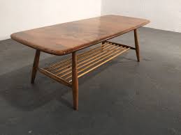 Vintage wood coffee table with magazine rack and surfboard travertine top, 1960s. Vintage Furniture Ireland Ocd August 2016