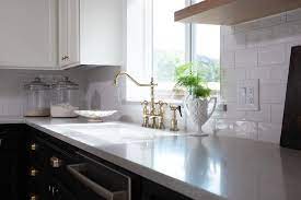It will work well with glossy subway tile and stainless steel appliances. White And Black Kitchen With White Subway Tiles Transitional Kitchen
