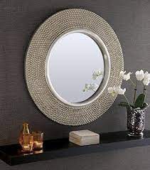 Perforated perfection is what comes to mind when we see this fierce mirror. Product Category Casegoods Covethouse Framed Mirror Wall Mirror Decor Silver Wall Mirror