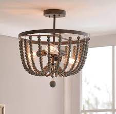The stunning distressed white finish is perfect for farmhouse and traditional spaces. Tilden 3 Light Semi Flush Mount Wood Bead Chandelier Semi Flush Ceiling Lights Flush Ceiling Lights