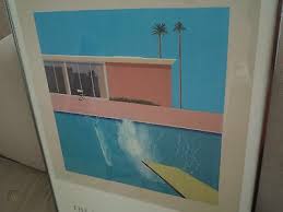 Measuring 242.5 centimetres (95.5 in) by 243.9 centimetres (96.0 in), it depicts a swimming pool beside a modern house, disturbed by a large splash of water created by an unseen figure who has apparently just jumped in from a diving board. Vintage 1985 David Hockney A Bigger Splash Poster 539937149