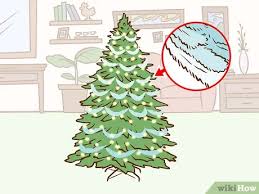 Featuring a gorgeous gradient palette, this tree starts with black at the top, transitions to gray in the middle, and ends with silver at the bottom. 3 Ways To Decorate A Christmas Tree In Ombre Wikihow