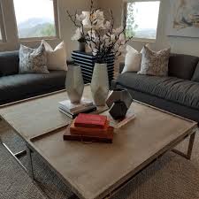 This living room has an interesting pattern of hardwood flooring between black and light wood. How To Style A Coffee Table Nestorations San Diego Interior Design Coffee Table Large Coffee Tables Decorating Coffee Tables