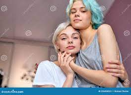 Relaxed Lesbian Couple Embracing on Bed and Looking at Camera. Homosexual  Couple Stock Image - Image of homosexual, lgbt: 226450551