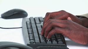 Close-up On Black Businessman Hands Typing