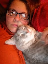 Lost cat. Our daughter's cat seems to be lost. His name is cuddles and he's  such a sweetheart. He has a white flea collar on. He's never been gone over  night and