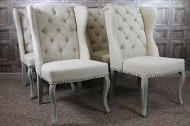 Make mealtimes more inviting with comfortable and attractive dining room and kitchen chairs. French Style Button Back Winged Dining Chairs In Cream Linen And Limed Legs Dining Chairs Upholstered Dining Chairs Tufted Dining Chairs