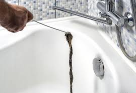 Clean a clogged bathtub drain with hair. How To Unclog A Bathroom Drain Rj Tilley
