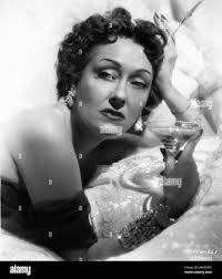 GLORIA SWANSON Portrait as Norma Desmond in SUNSET BOULEVARD 1950 director  BILLY WILDER writers CHARLES BRACKETT BILLY WILDER and D. M. MARSHMAN Jr  Costume design EDITH HEAD Paramount Pictures Stock Photo