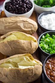 With the right toppings, an ordinary baked potato can turn into one incredible meal. Baked Potato Bar Ideas Entertaining On A Budget Dishing Delish