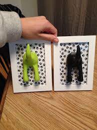 Leash Holders I Made For All Of Dexters Leashes Picture Frame Scrapbook Paper And Ikea Dog Tail Hooks Dog Leash Holder Diy Ikea Dog Diy Dog Stuff