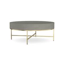 Our faux shagreen coffee table is designed with a round top over a bold triangular base with brass finish. Faux Shagreen Round Coffee Table Williams Sonoma