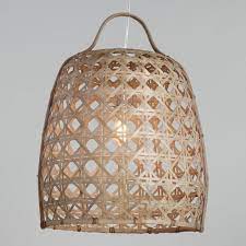 Handwoven By Filipino Artisans Of Bamboo With A Cane Basket Inspired Design That Filters Light Our Exclus Cane Baskets Tropical Decor Living Room Bamboo Canes