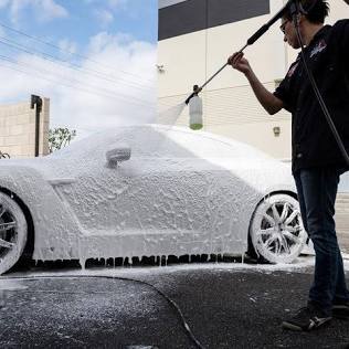 The Pre-Wash Phase: Breaking down dirt with a thick blanket of snow foam., AI generated