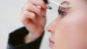 Close up o a woman attaching crystal mak...