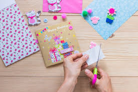 There are masculine cards, women cards, and cards for kids. Free Photo Close Up Of A Person Making Happy Birthday Greeting Card