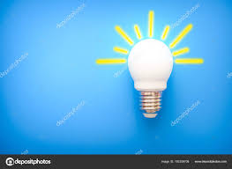 Led Light Bulb With Yellow Rays On Blue Background Stock Photo C Shtak3t 192359708