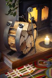 Iron work firewood wood wood storage rack blacksmithing fireplace wood storage fireplace wings of flight fire wood holder graceful curves of steel caress an ample supply of firewood. Gorgeous Wrought Iron Log Ring From Iapetus Co Uk Iron Furniture Firewood Storage Indoor Metal Furniture