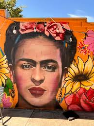 Fort Mill's own Caroline Simais paints the town bright with her "Love Where  you Live" mural located