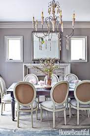 Rich camel walls and crisp white trim tastefully frame an enoc perez oil painting in this new york dining room designed by daniel romualdez. 18 Best Dining Room Paint Colors Modern Color Schemes For Dining Rooms