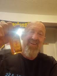 What a dumbass! When you're served a flaming drink, you're supposed to blow  out the flame before you drink it!