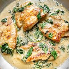 This Chicken Florentine dish features succulent pan-seared chicken  smothered in a delectable creamy garlic spinach white wine sauce, all  prepared swiftly in just 30 minutes.