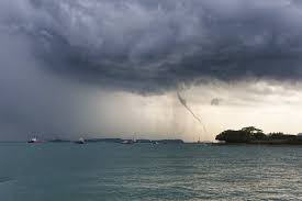 A waterspout is like a tornado over water and usually does not last long. Waterspout Spirals Down On Southern Singapore Coconuts Singapore