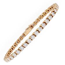 An 18k yellow gold diamond set heart charm by cartier. Cartier 6 30 Carat Diamond Gold Tennis Bracelet Tennis Bracelet Diamond Bracelets Gold Diamond Diamond Bracelet