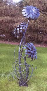 Each one is plasma cut, welded together, and then left outside to patina naturally. Forged Steel Sun Flower Metal Garden Art Welding Art Projects Metal Art